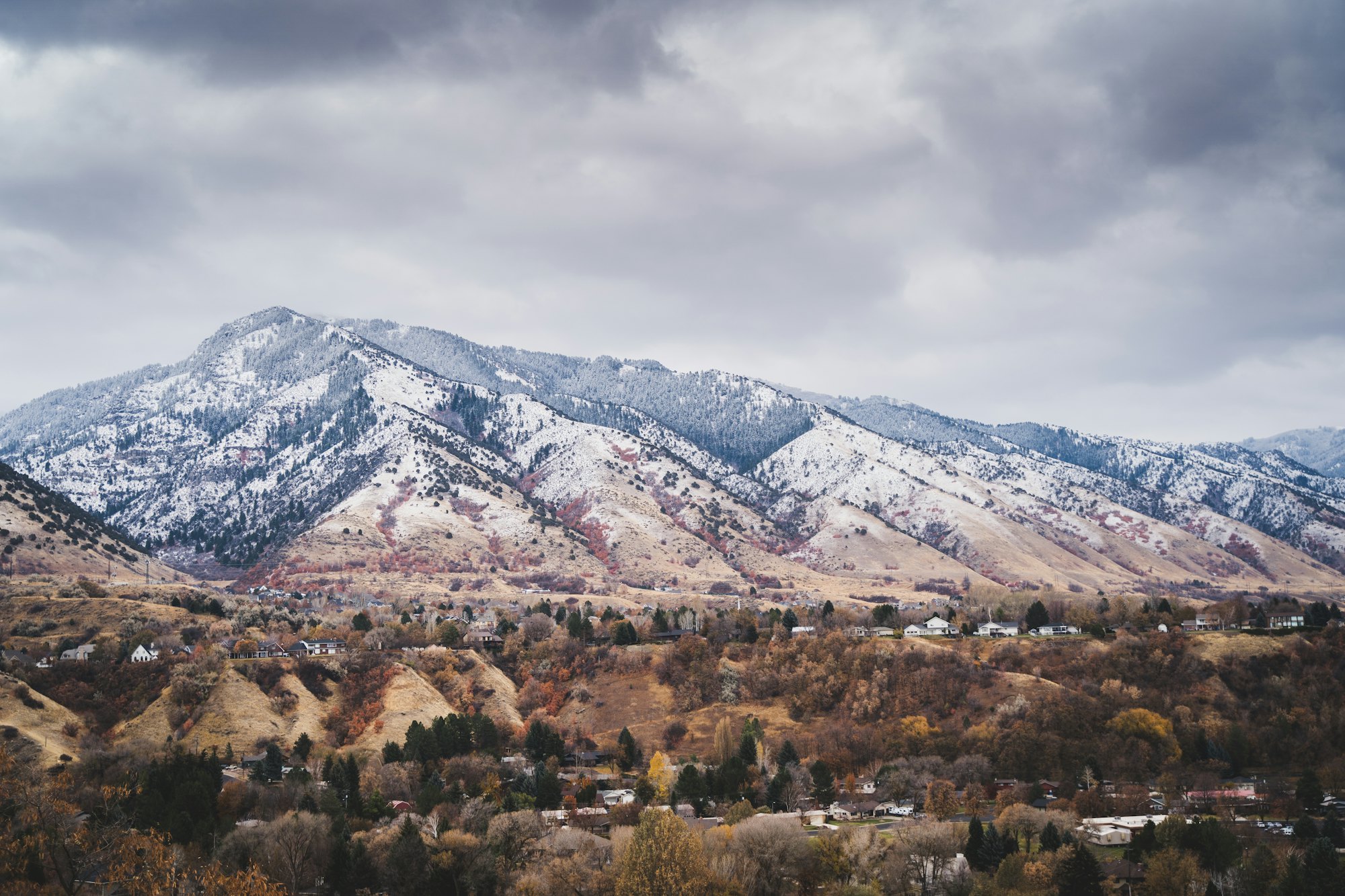 Autumn foothills and snow-dusted mountains above Logan, Utah